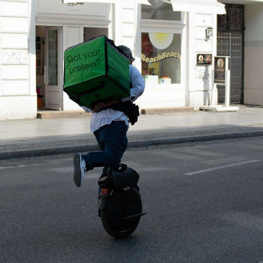 a food delivery person on a motorized unicycle, representing the concept of getting protein while traveling